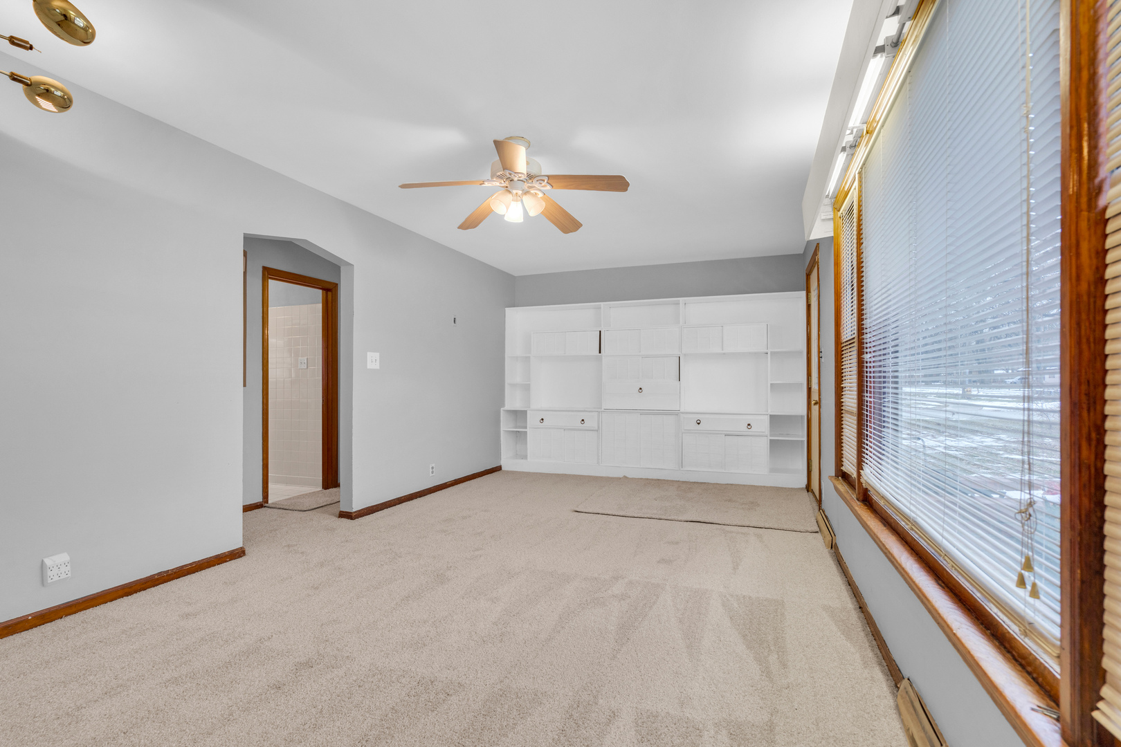 1760 East 158th Street Dolton, IL 60419 - Photo 2 of 22 en empty room with windows and ceiling fan