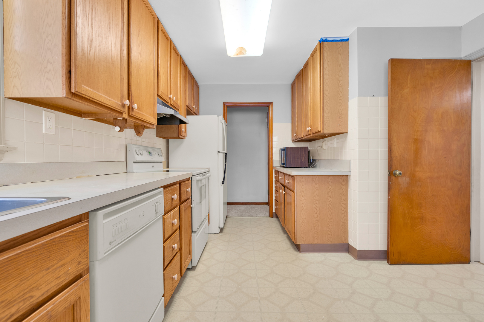 1760 East 158th Street Dolton, IL 60419 - Photo 7 of 22 a utility room with a sink a washer and dryer