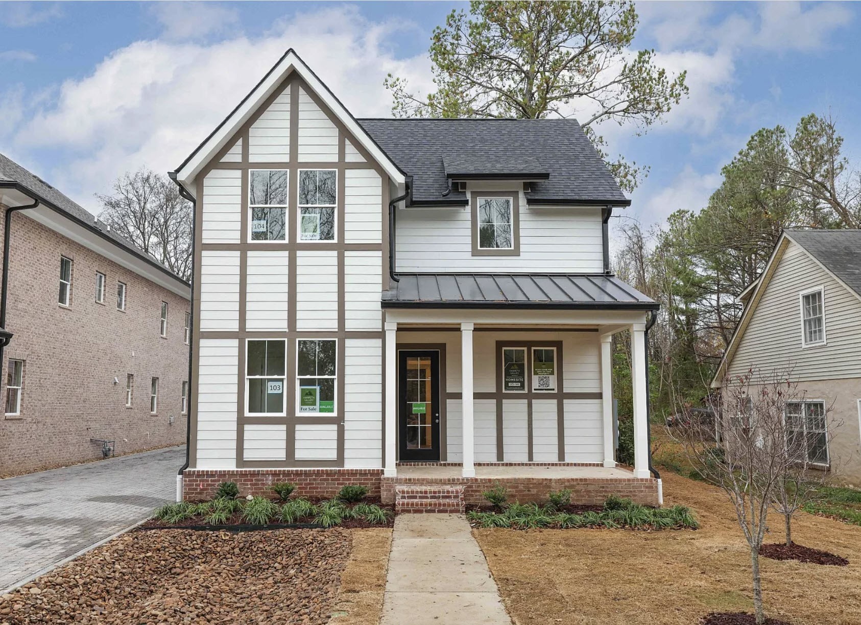 a front view of a house with a yard