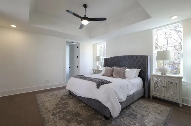 a bedroom with a large bed and a window