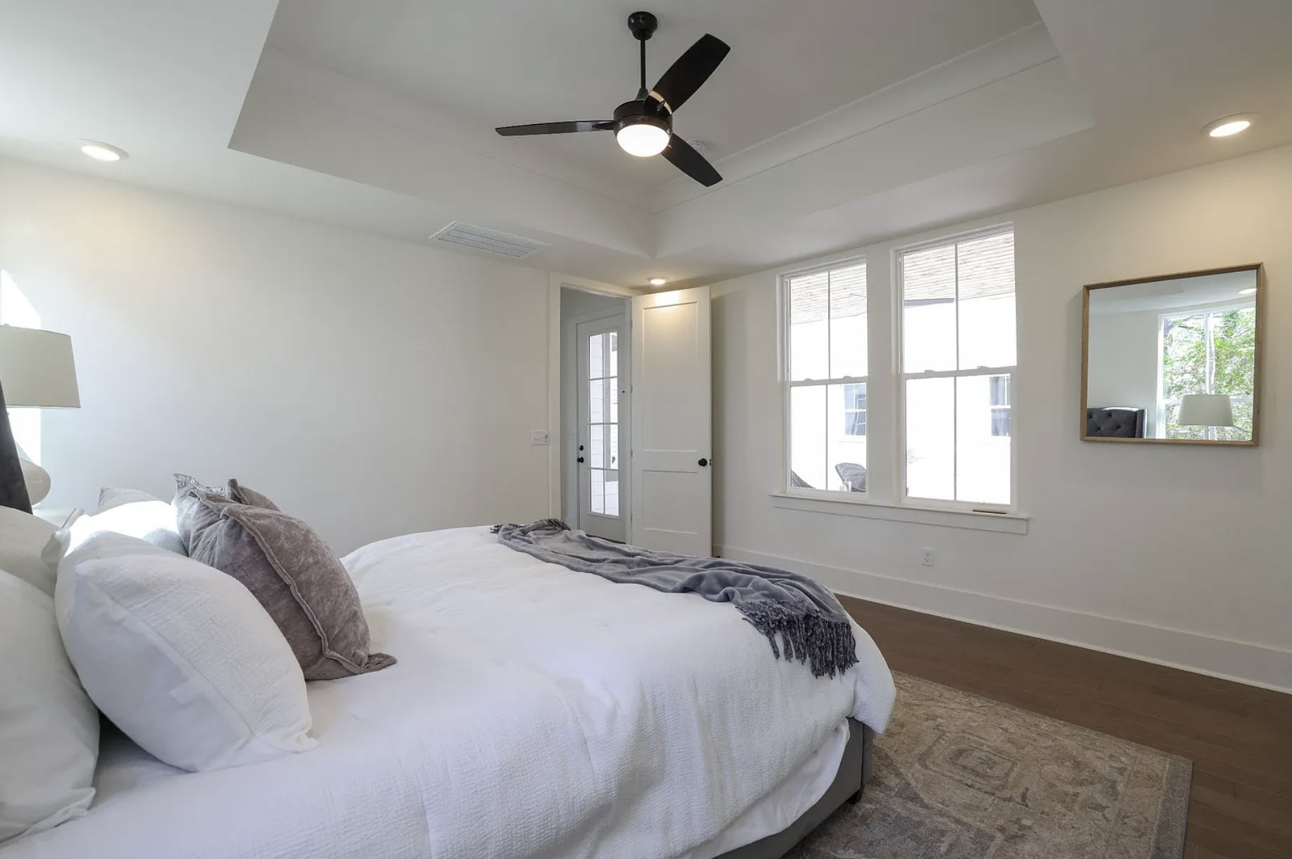 207 Fairground Street, Unit 103 Franklin, TN 37064 - Photo 13 of 27 a bed sitting in a bedroom next to a window