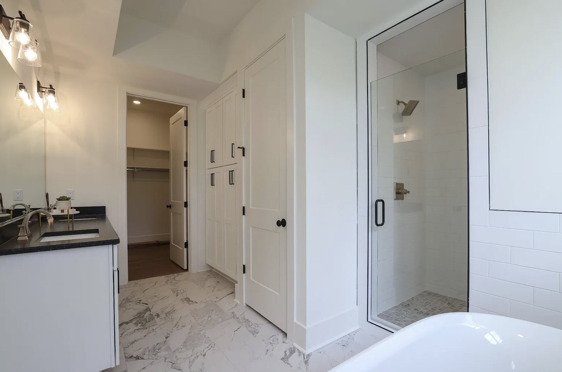 207 Fairground Street, Unit 103 Franklin, TN 37064 - Photo 16 of 27 a bathroom with a sink a toilet and shower