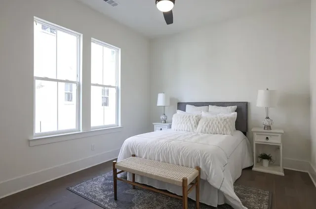 a bedroom with a bed and a window