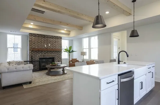 a kitchen with stainless steel appliances granite countertop a stove and a sink