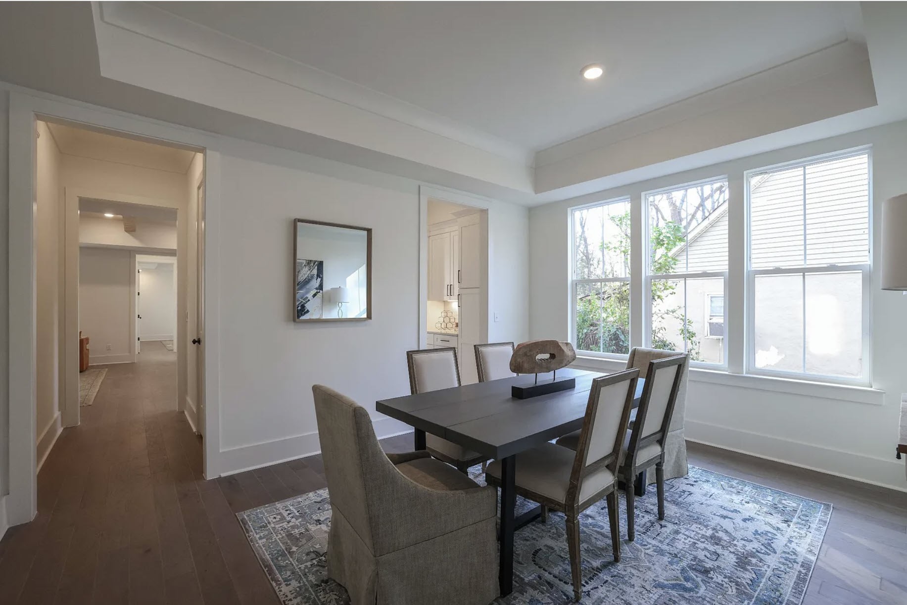 207 Fairground Street, Unit 103 Franklin, TN 37064 - Photo 10 of 27 a view of a dining room with furniture and wooden floor