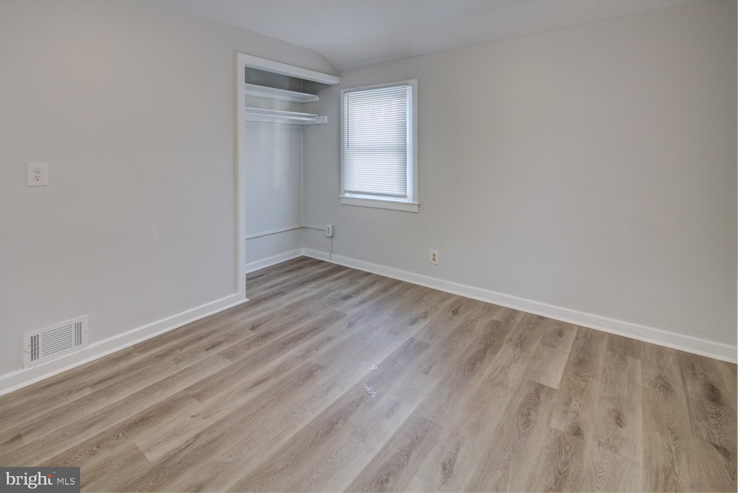 36 Thompson Circle Newark, DE 19711 - Photo 11 of 22 a view of an empty room with wooden floor and a window