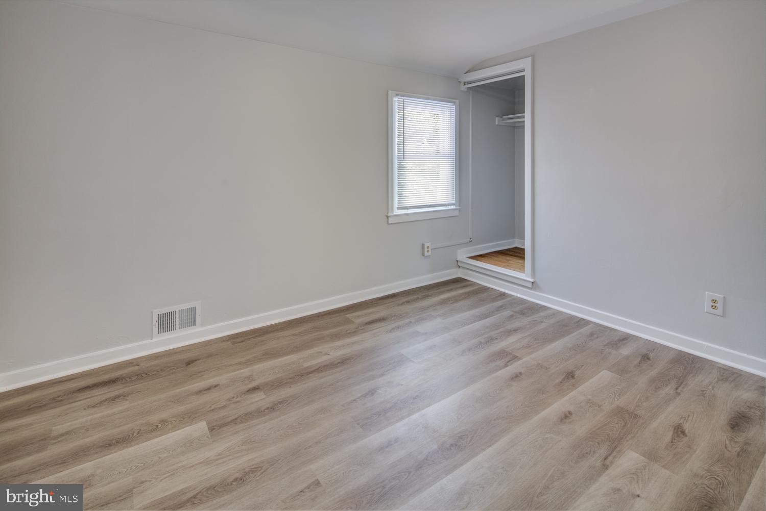 36 Thompson Circle Newark, DE 19711 - Photo 12 of 22 an empty room with wooden floor and windows