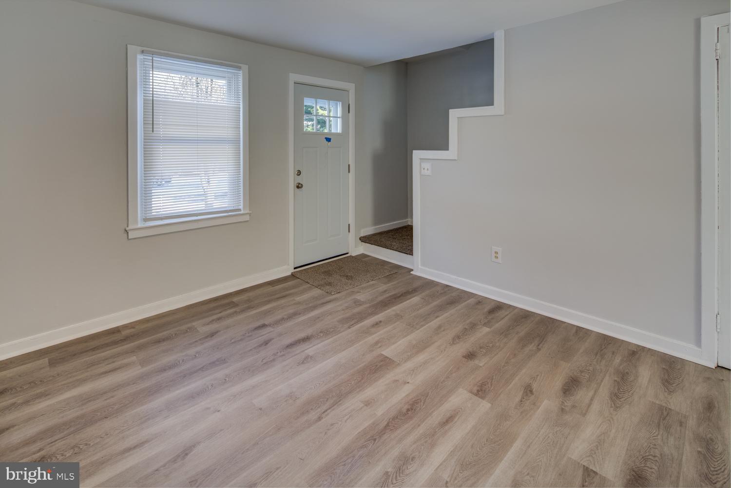 36 Thompson Circle Newark, DE 19711 - Photo 14 of 22 an empty room with wooden floor and windows