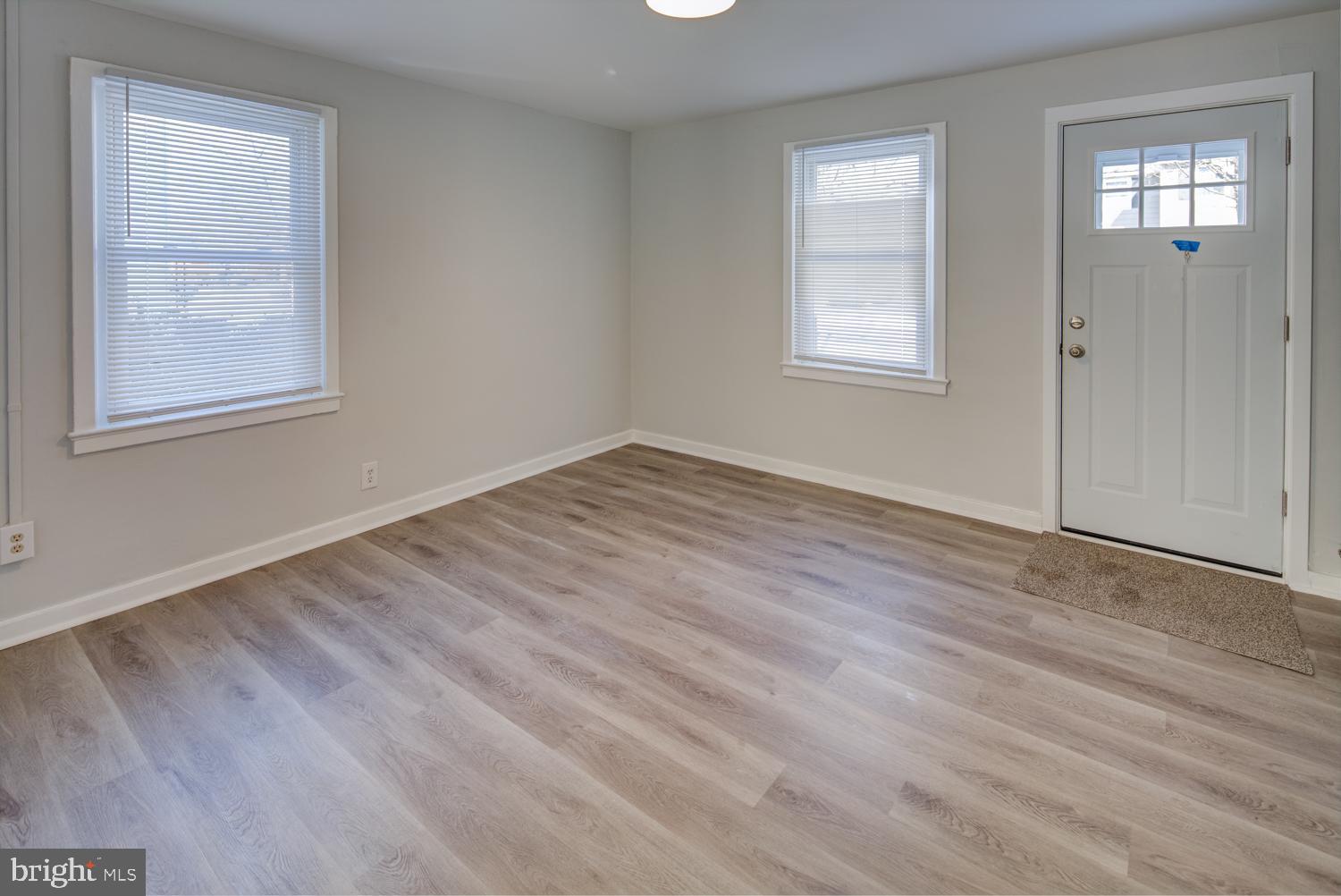 36 Thompson Circle Newark, DE 19711 - Photo 5 of 22 a view of an empty room with wooden floor and window