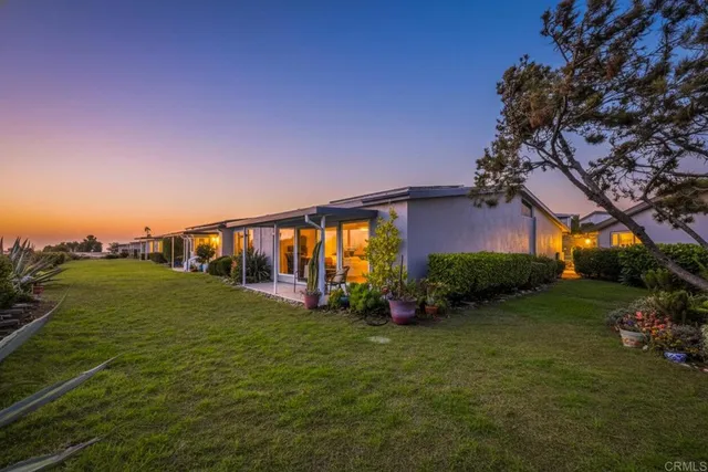 a view of a house with a big yard