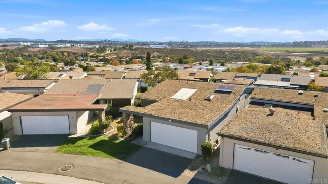 a view of a terrace with wooden floor and ocean view