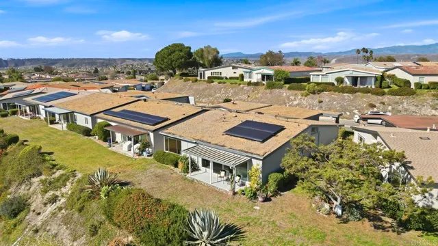 a view of a lake with houses with outdoor space