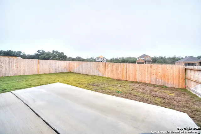 a view of a backyard with a lake view
