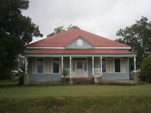 5091 Pine Level Road Ideal, GA 31041 - Photo 1 of 13 a front view of a house with a garden