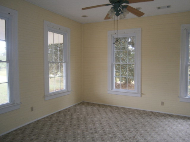 5091 Pine Level Road Ideal, GA 31041 - Photo 12 of 13 an empty room with a window and a fan