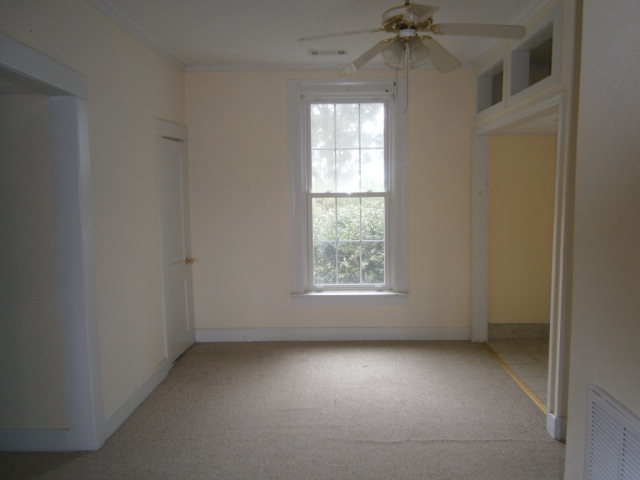 5091 Pine Level Road Ideal, GA 31041 - Photo 8 of 13 an empty room with a window