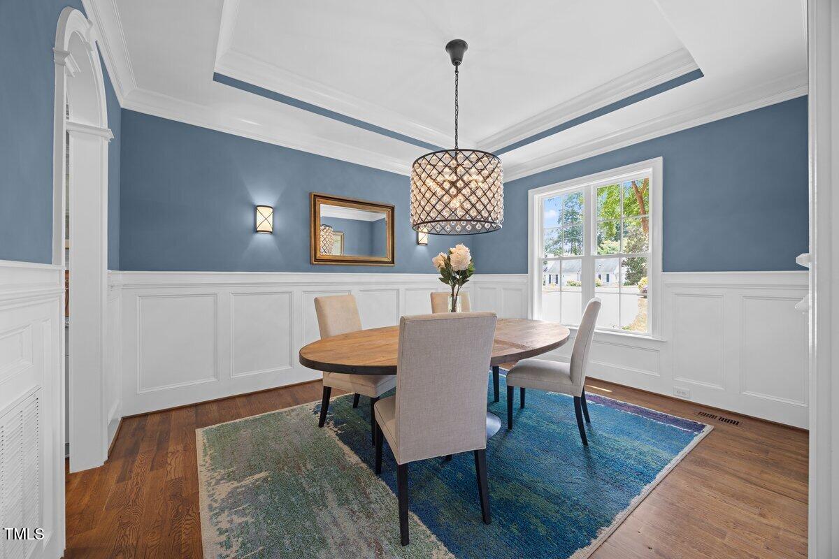 3034 Lewis Farm Road Raleigh, NC 27607 - Photo 11 of 60 a view of a dining room with furniture window and wooden floor