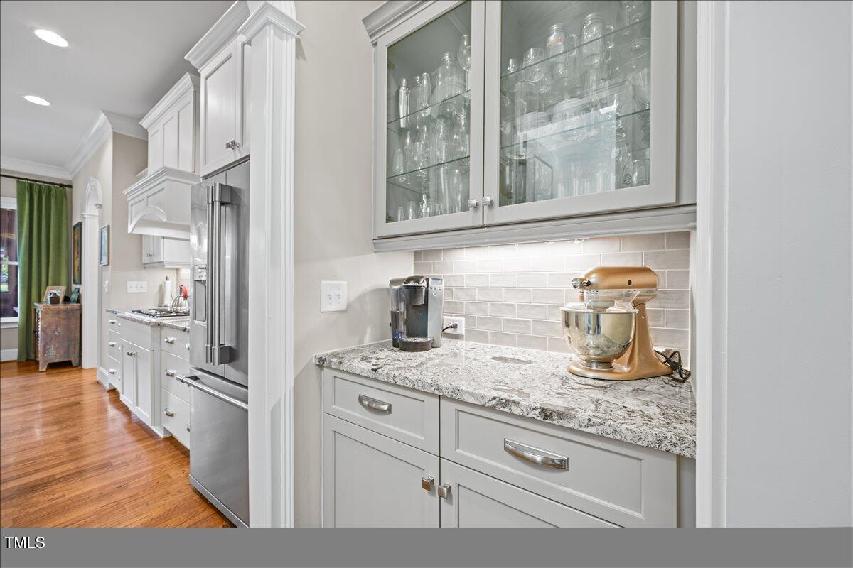 3034 Lewis Farm Road Raleigh, NC 27607 - Photo 13 of 60 a kitchen with stainless steel appliances granite countertop a refrigerator and a sink