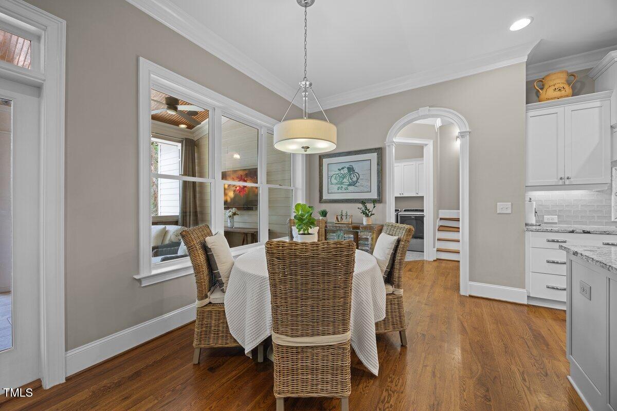 3034 Lewis Farm Road Raleigh, NC 27607 - Photo 20 of 60 a view of a dining room with furniture window and wooden floor