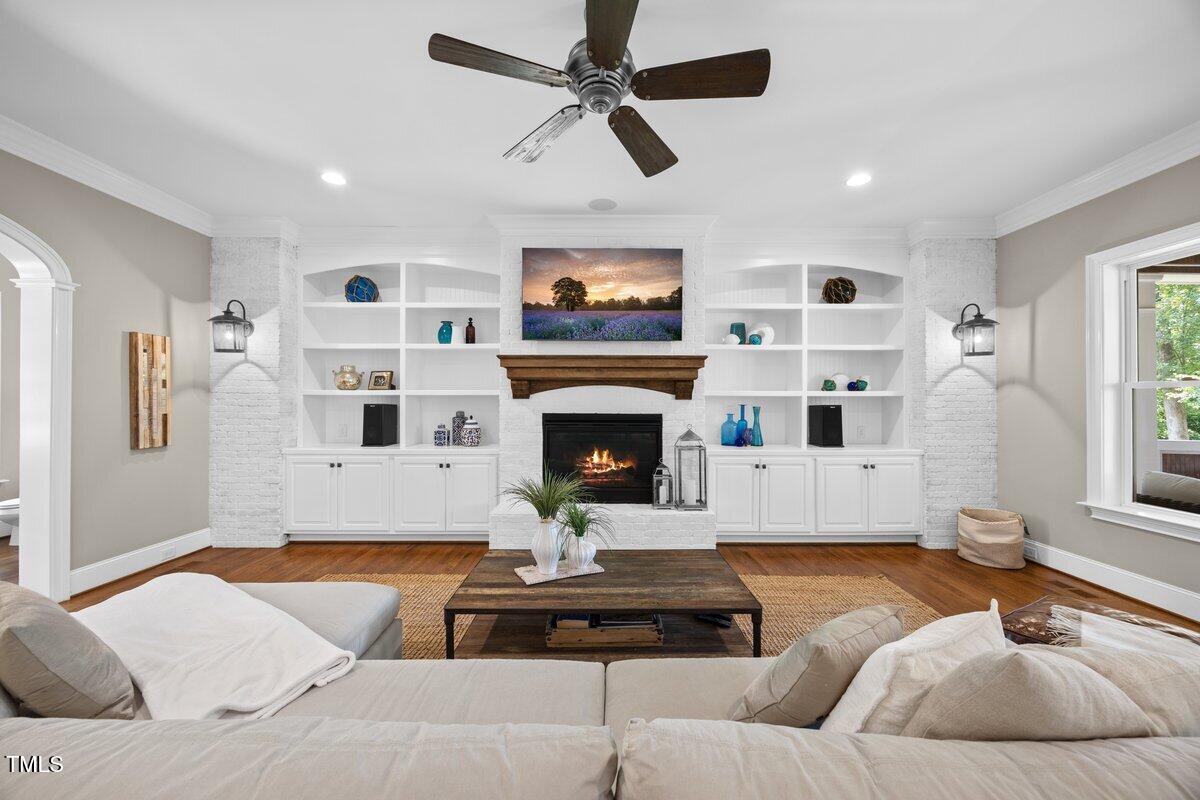 3034 Lewis Farm Road Raleigh, NC 27607 - Photo 21 of 60 a living room with furniture fireplace and window