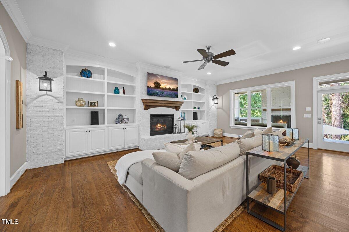 3034 Lewis Farm Road Raleigh, NC 27607 - Photo 23 of 60 a living room with furniture fireplace and flat screen tv