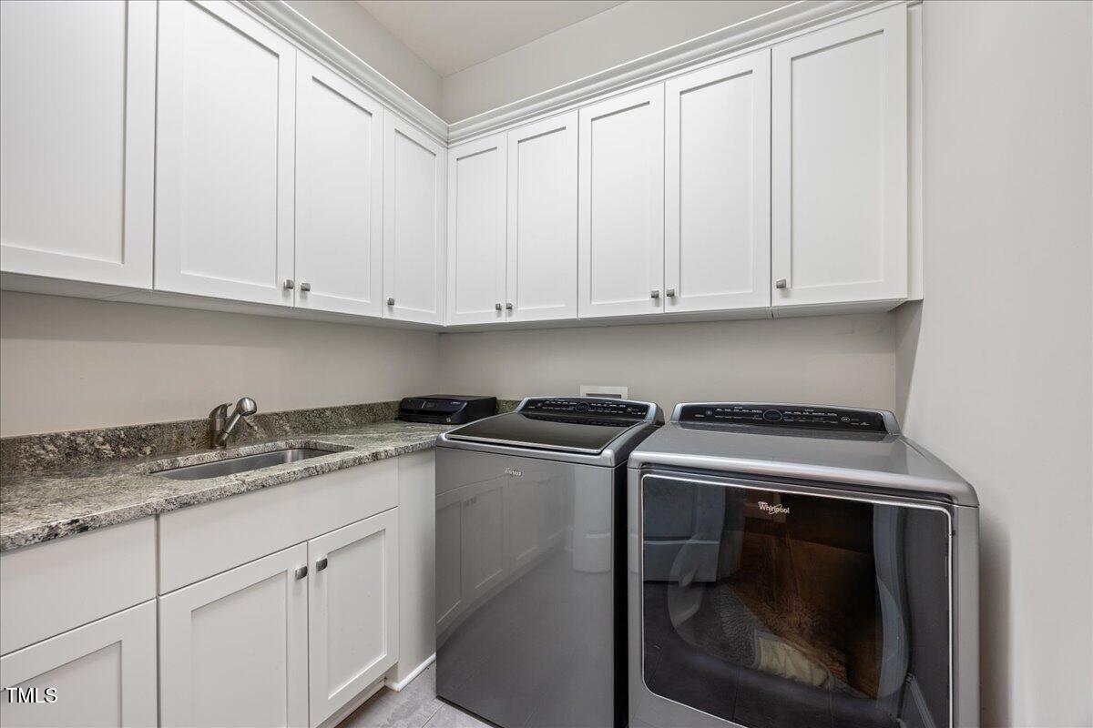 3034 Lewis Farm Road Raleigh, NC 27607 - Photo 24 of 60 a kitchen with granite countertop cabinets stainless steel appliances and a sink