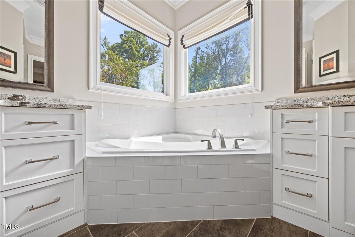 3034 Lewis Farm Road Raleigh, NC 27607 - Photo 29 of 60 a bathroom with a sink and a window