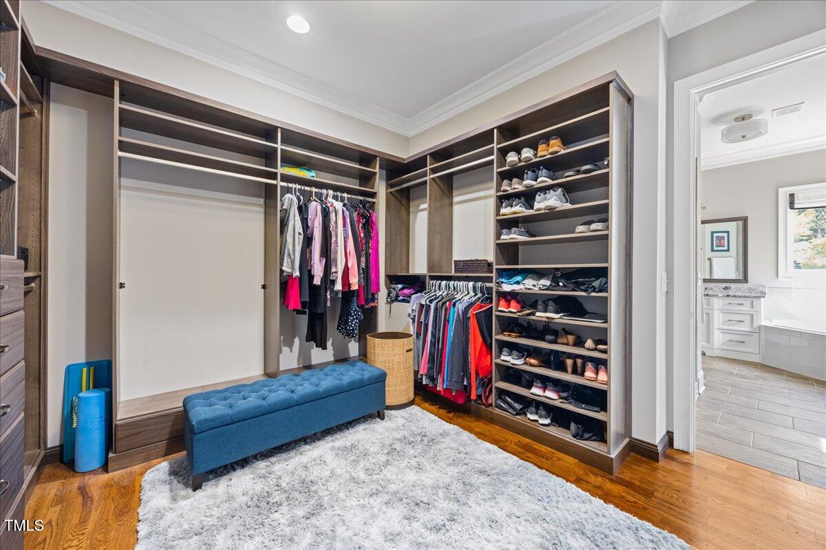 3034 Lewis Farm Road Raleigh, NC 27607 - Photo 32 of 60 a view of walk in closet with clothes and shoes