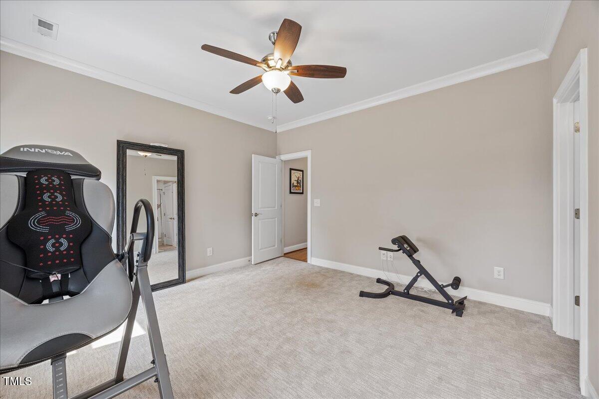 3034 Lewis Farm Road Raleigh, NC 27607 - Photo 34 of 60 a view of a livingroom with furniture and a ceiling fan