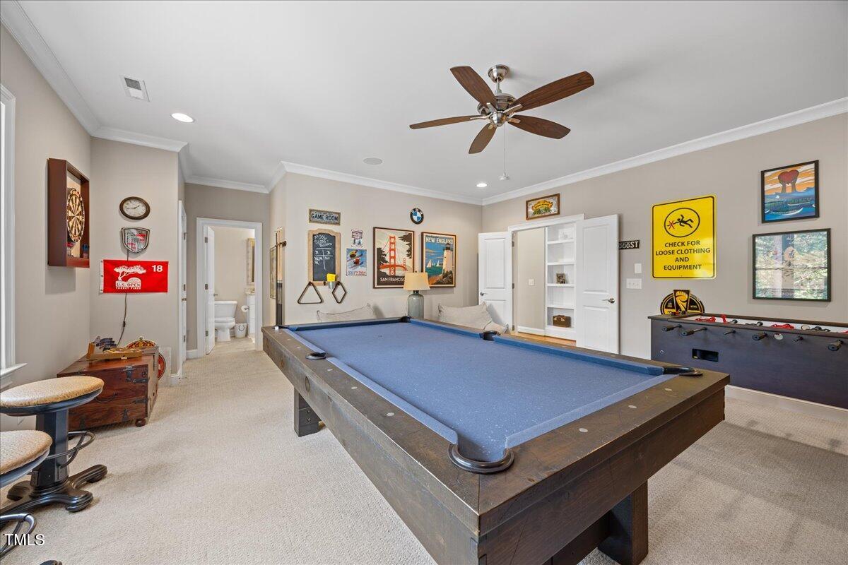 3034 Lewis Farm Road Raleigh, NC 27607 - Photo 38 of 60 a room with furniture and ceiling fan