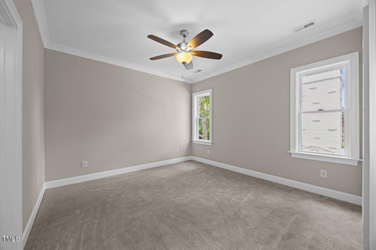 3034 Lewis Farm Road Raleigh, NC 27607 - Photo 45 of 60 a view of a livingroom with a ceiling fan and window