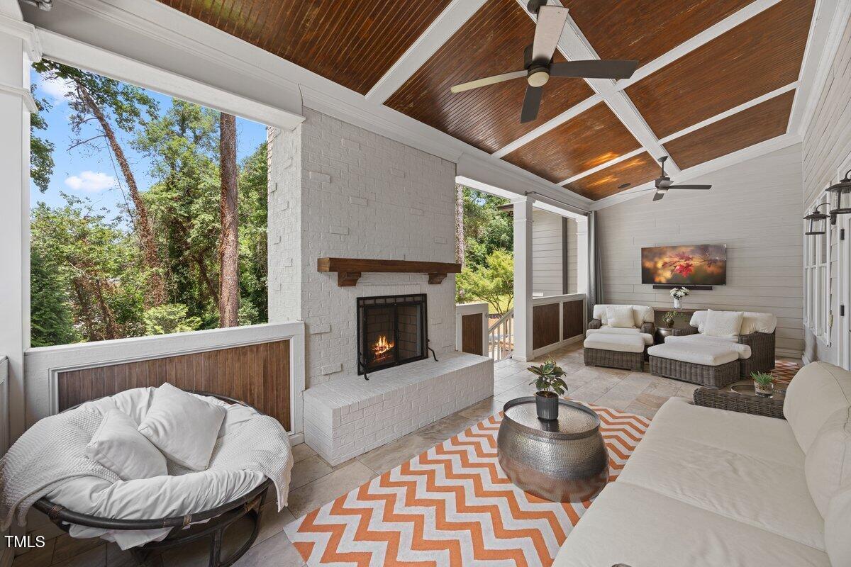 3034 Lewis Farm Road Raleigh, NC 27607 - Photo 50 of 60 a living room with furniture and a fireplace
