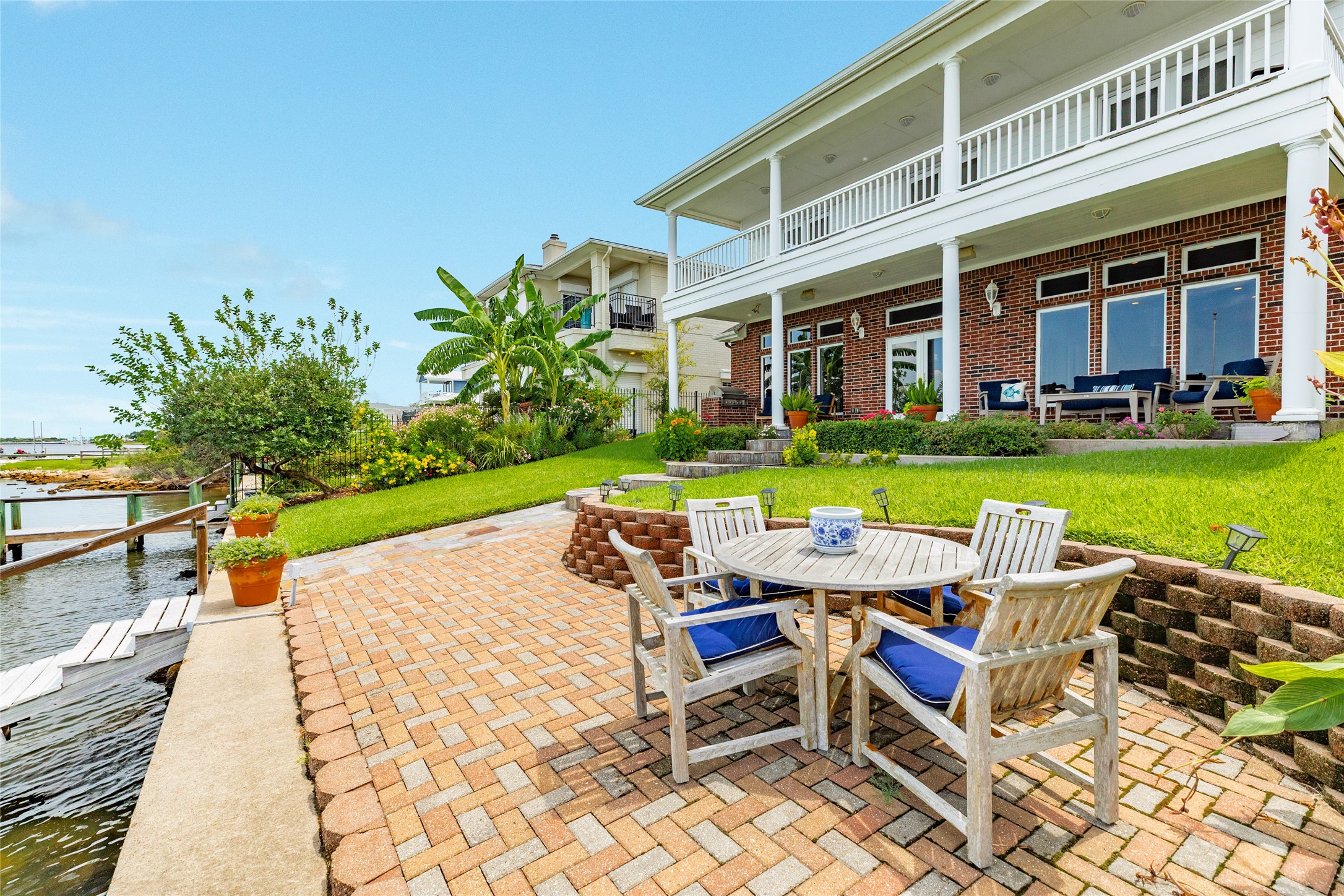 7306 Offats Point Circle Galveston, TX 77551 - Photo 11 of 50 a table and chairs in front of a house