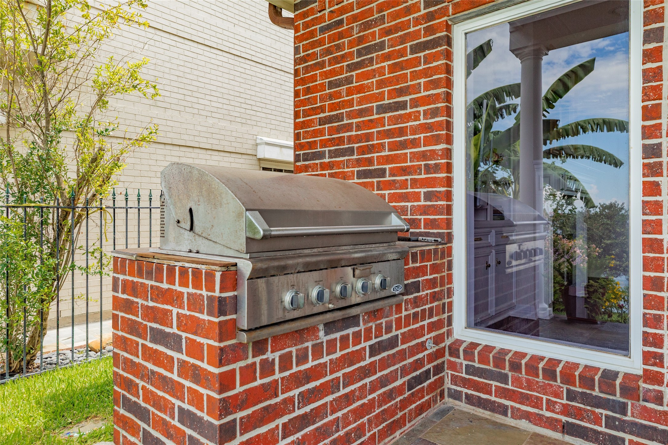 7306 Offats Point Circle Galveston, TX 77551 - Photo 15 of 50 a view of a brick building with many windows