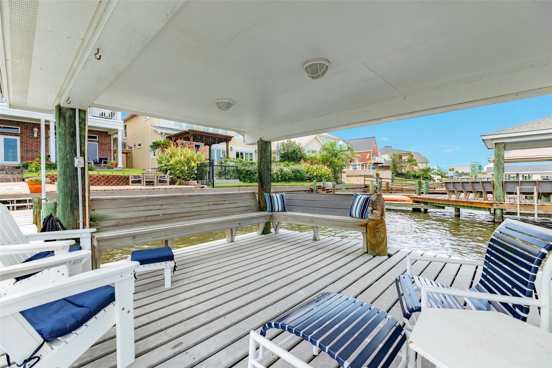 7306 Offats Point Circle Galveston, TX 77551 - Photo 17 of 50 a outdoor space with patio the couches and a dining table with garden view