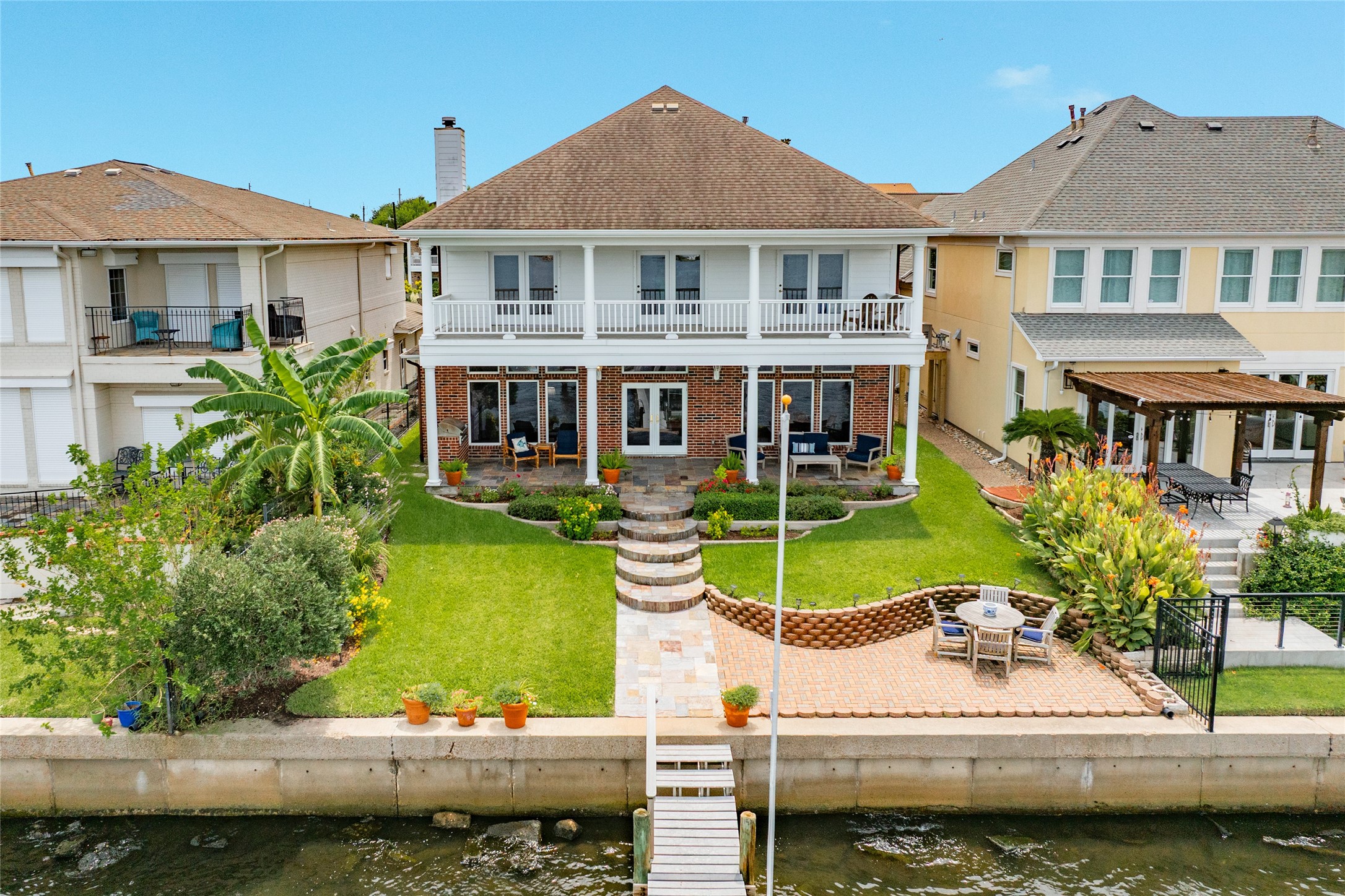 7306 Offats Point Circle Galveston, TX 77551 - Photo 2 of 50 front view of a house with a swimming pool