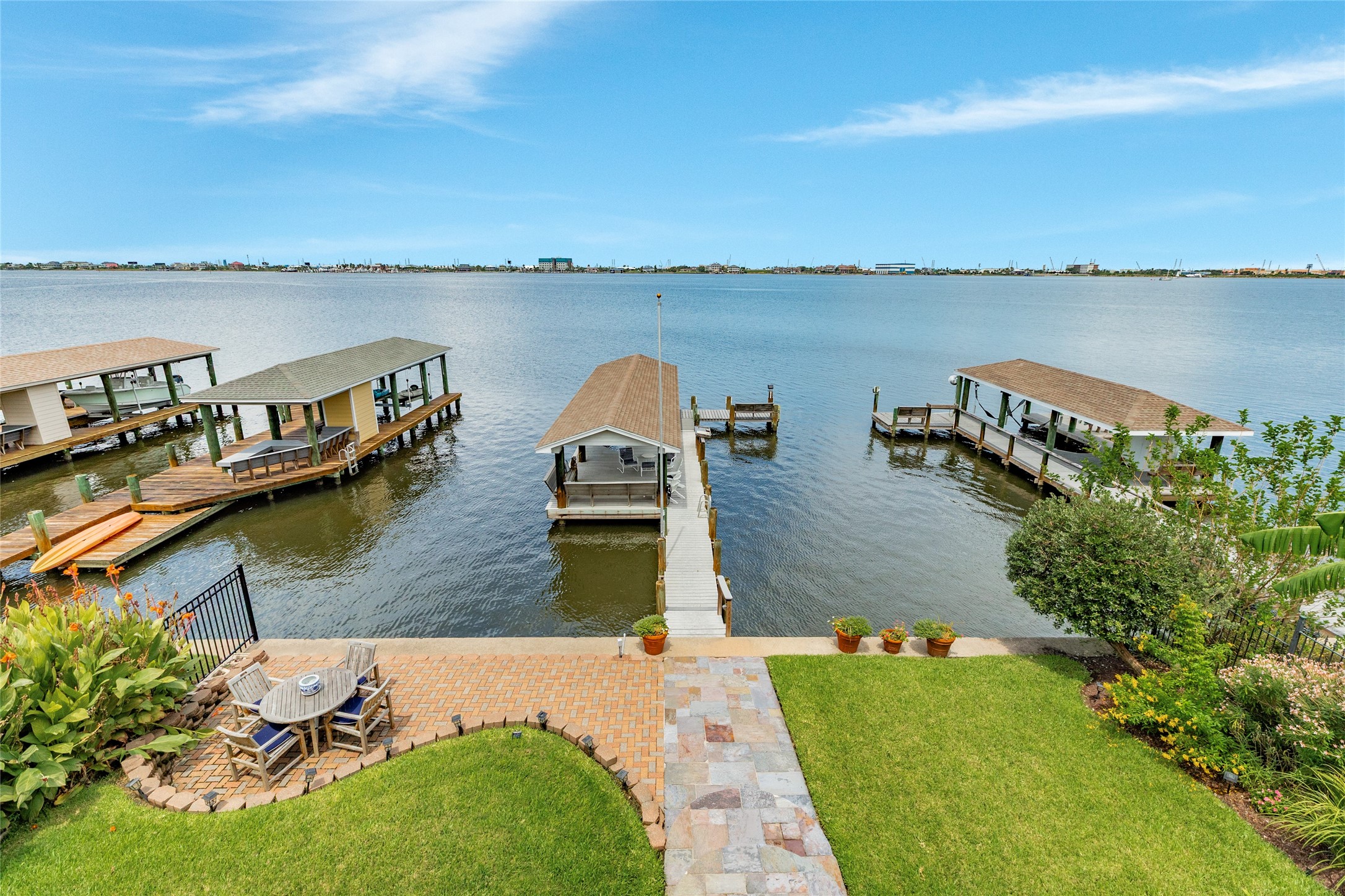 7306 Offats Point Circle Galveston, TX 77551 - Photo 24 of 50 a view of a lake with houses with outdoor space