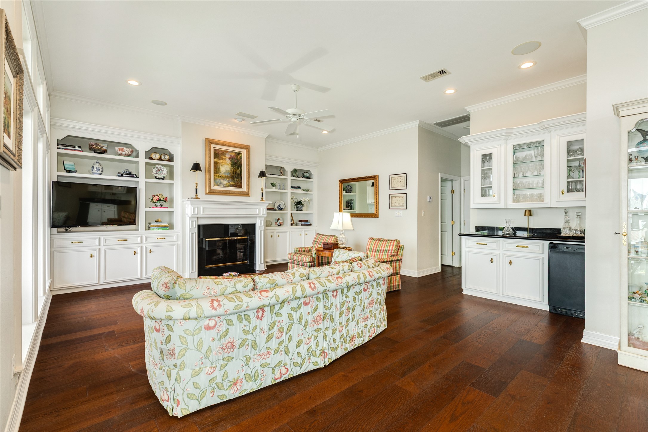 7306 Offats Point Circle Galveston, TX 77551 - Photo 27 of 50 a living room with furniture fireplace and flat screen tv