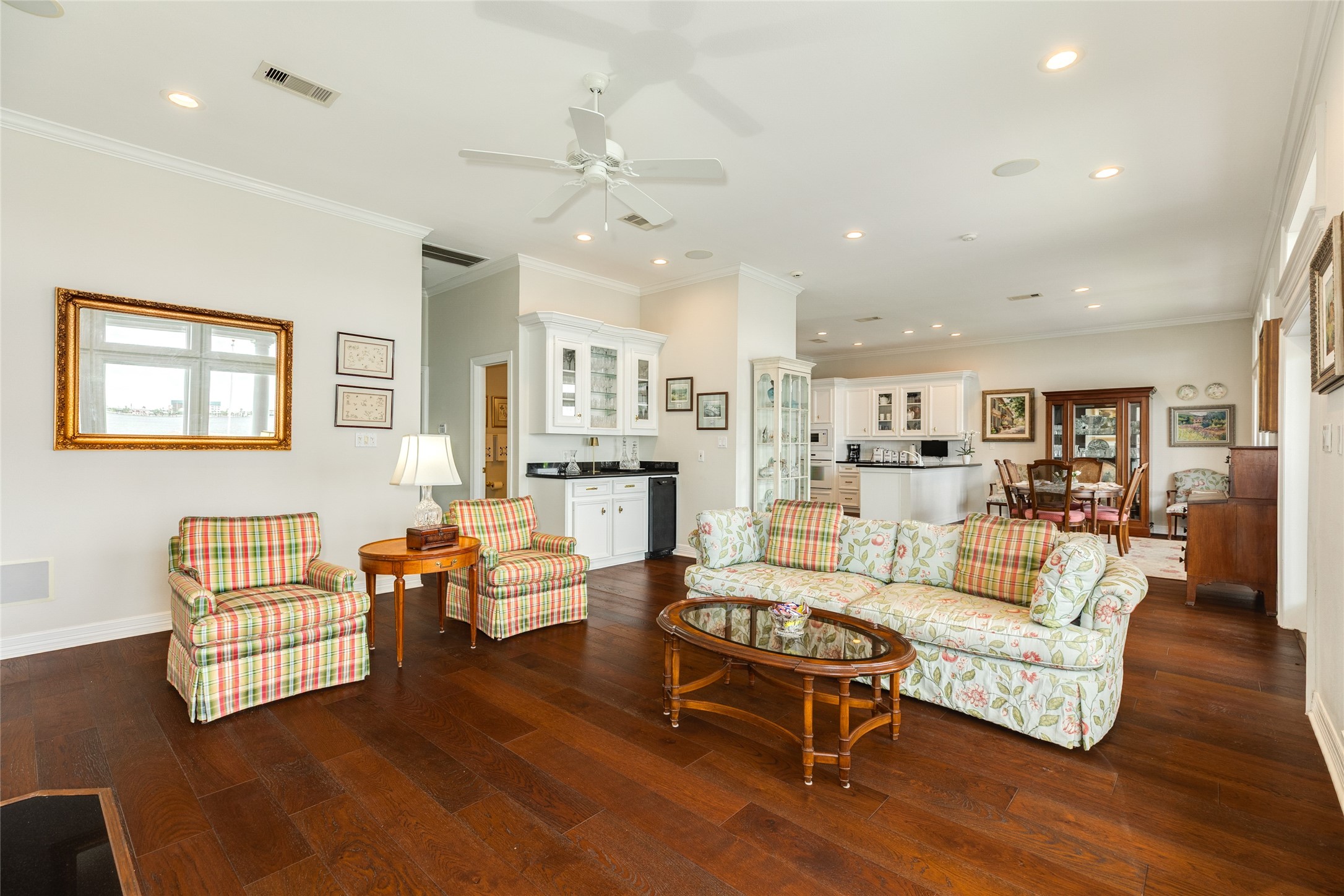 7306 Offats Point Circle Galveston, TX 77551 - Photo 29 of 50 a living room with fireplace furniture and a wooden floor