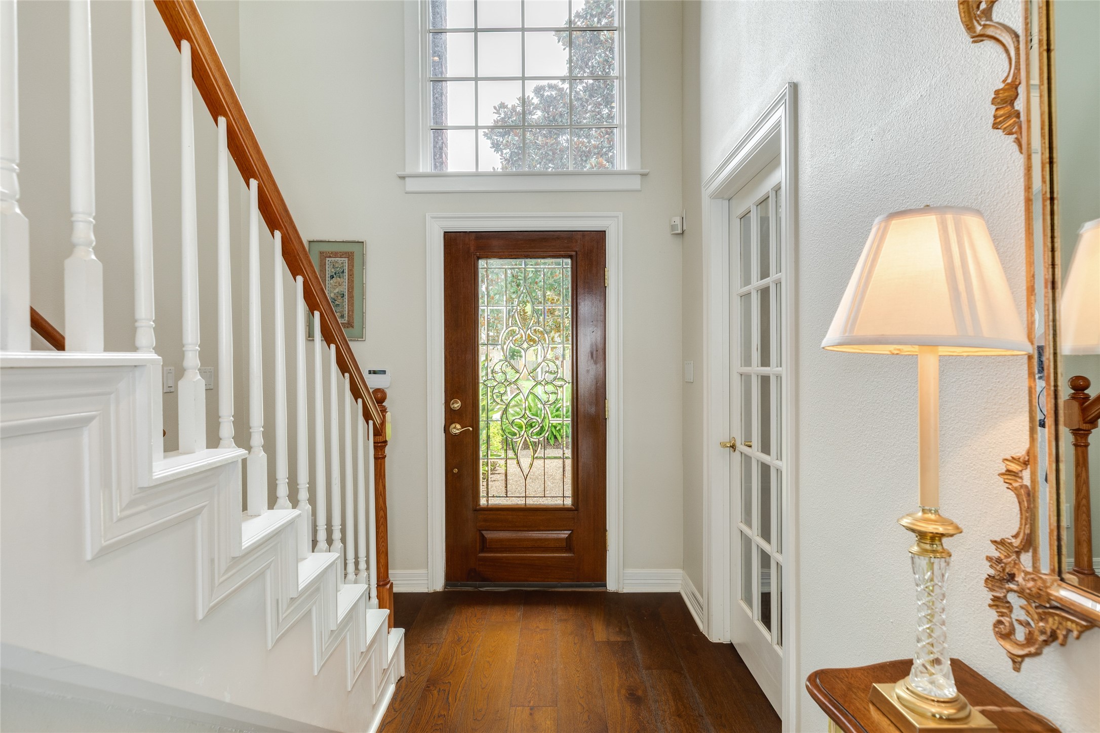 7306 Offats Point Circle Galveston, TX 77551 - Photo 36 of 50 a view of entryway with wooden floor and stair