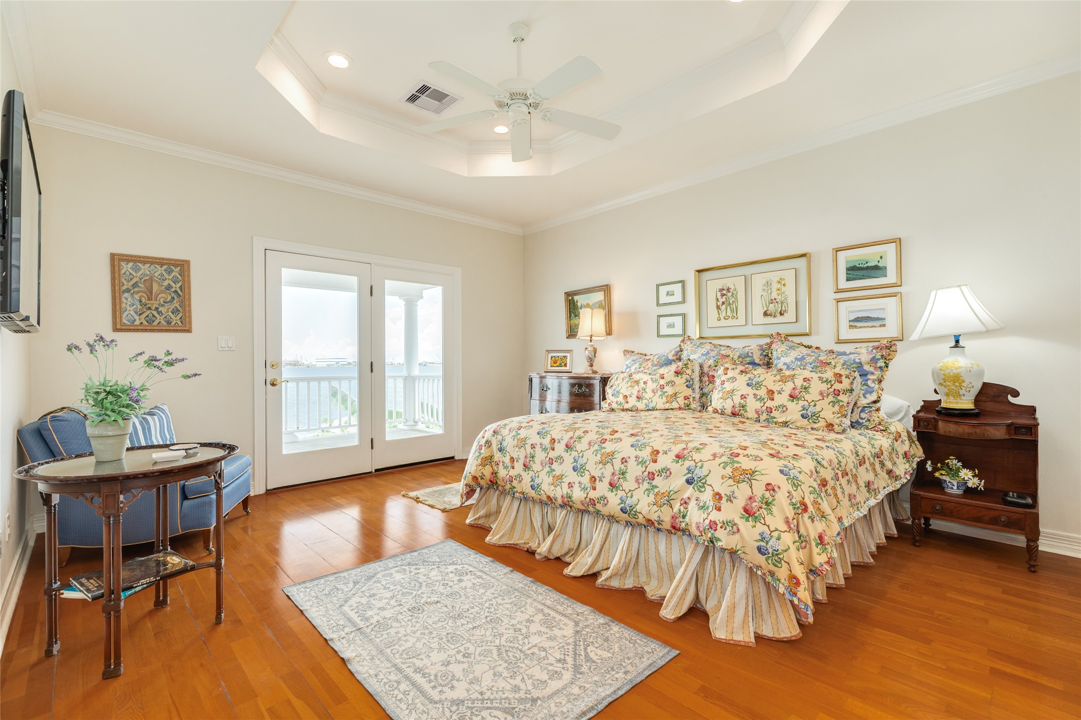 7306 Offats Point Circle Galveston, TX 77551 - Photo 41 of 50 a spacious bedroom with a bed and a table in it