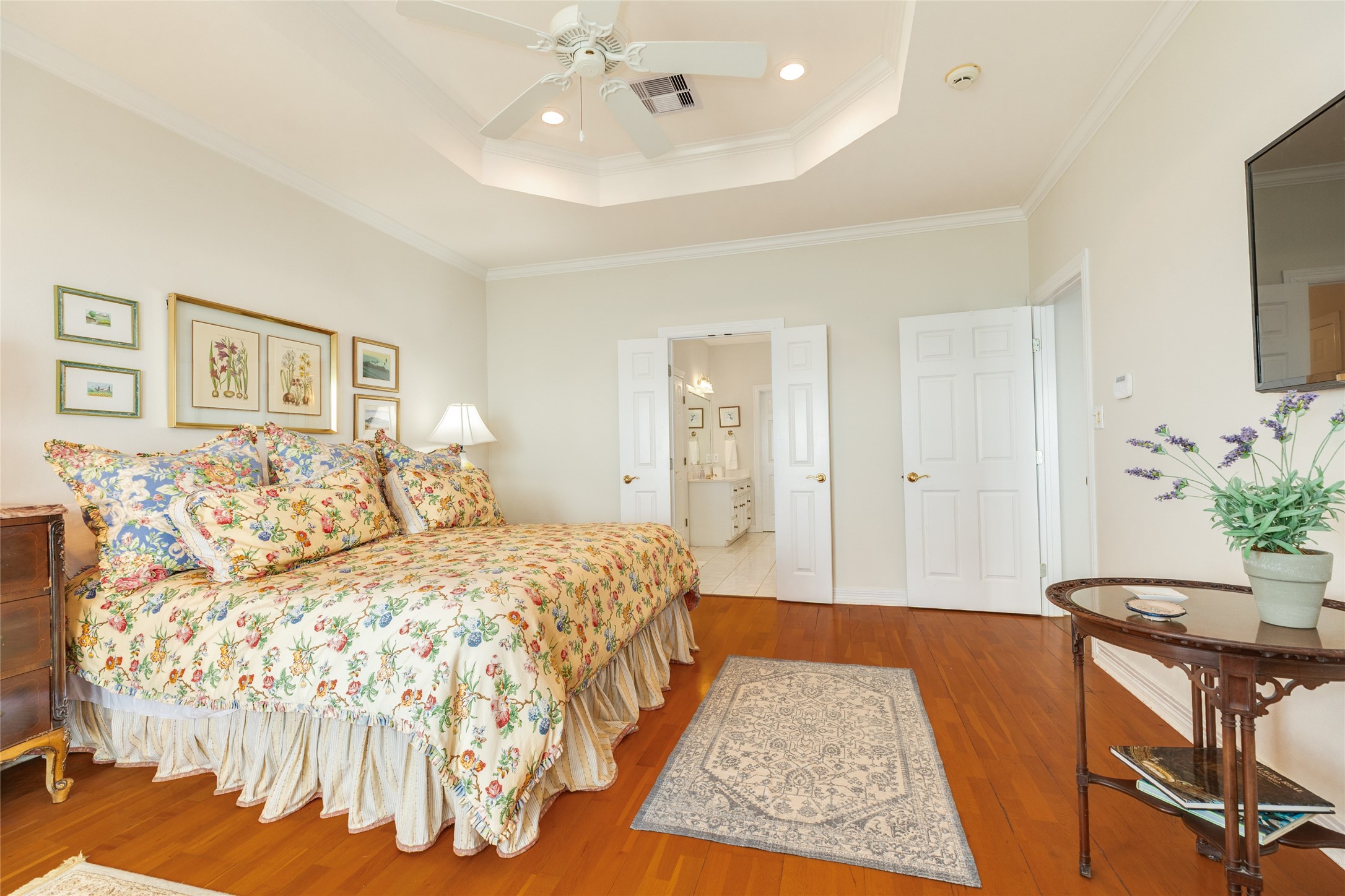 7306 Offats Point Circle Galveston, TX 77551 - Photo 42 of 50 a bedroom with a large bed and a chandelier