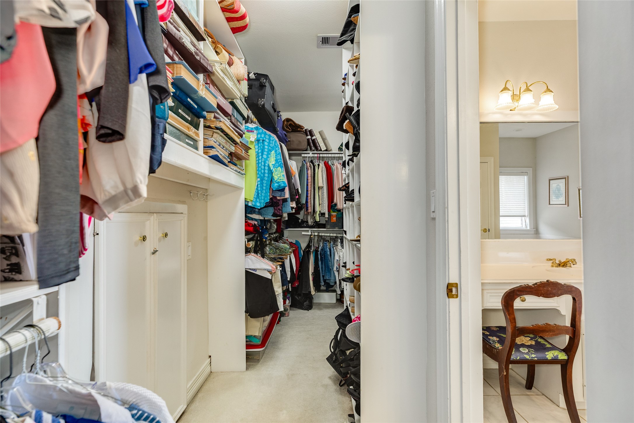 7306 Offats Point Circle Galveston, TX 77551 - Photo 45 of 50 a view of walk in closet with clothes