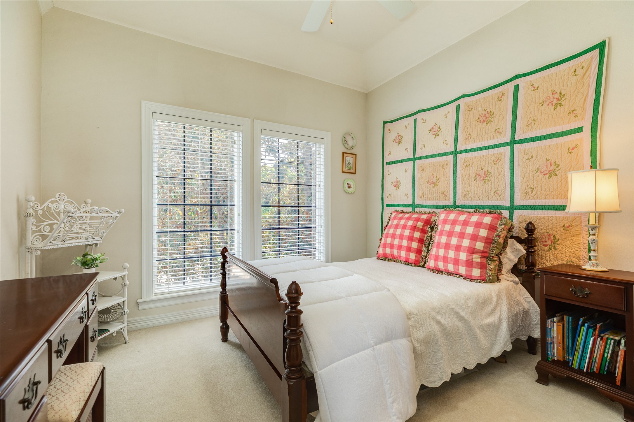 7306 Offats Point Circle Galveston, TX 77551 - Photo 47 of 50 a bedroom with a bed a bookshelf and a window