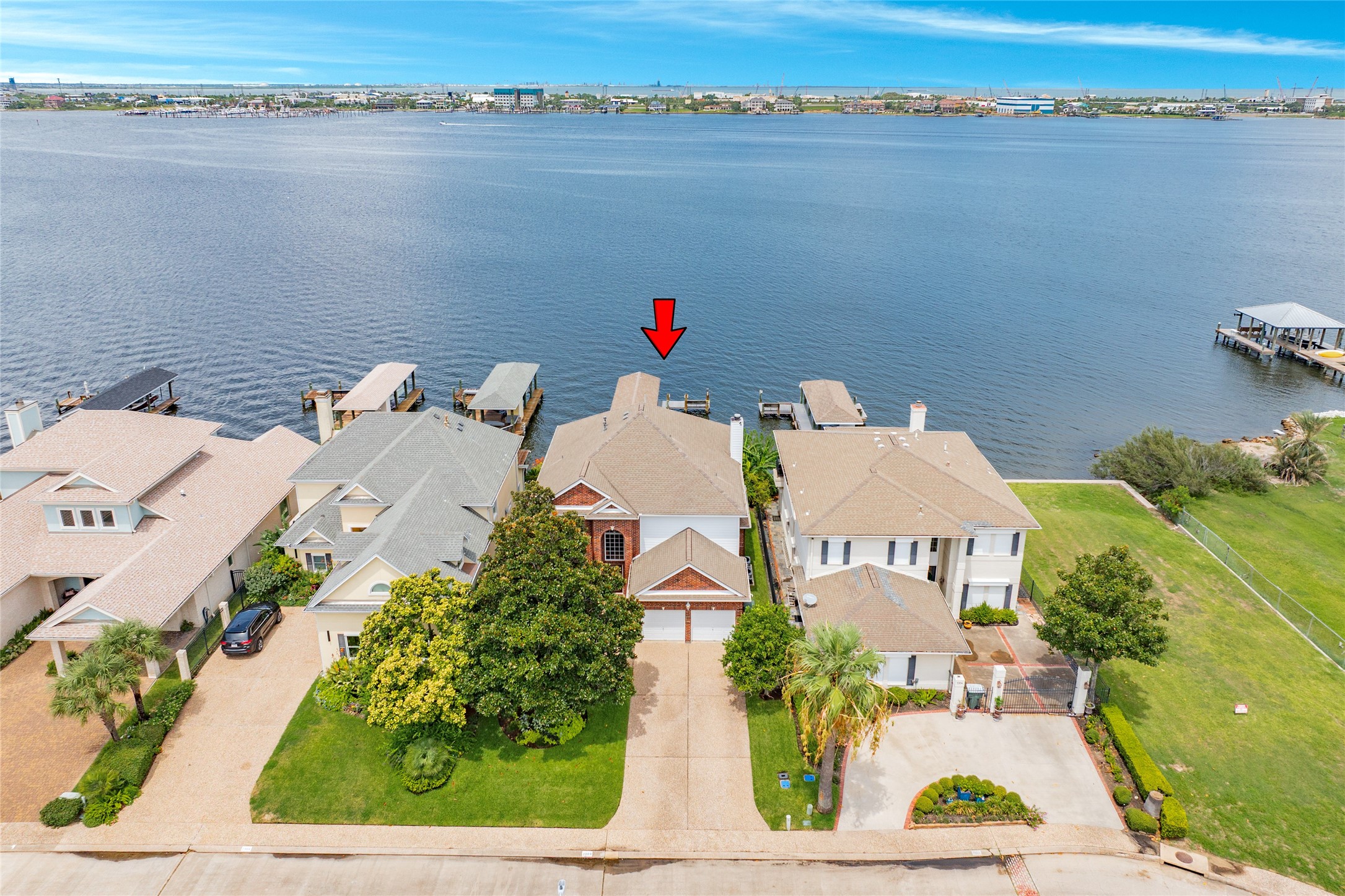 7306 Offats Point Circle Galveston, TX 77551 - Photo 7 of 50 an aerial view of a house with outdoor space swimming pool and lake view
