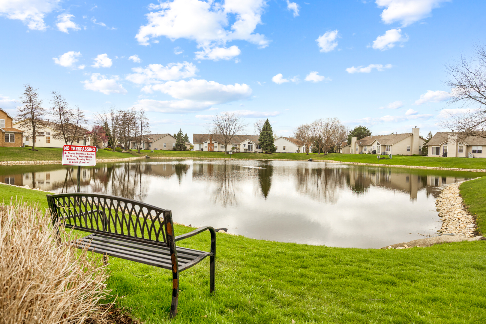 1014 Edinburgh Court Joliet, IL 60431 - Photo 23 of 25 a view of a lake with houses in the back