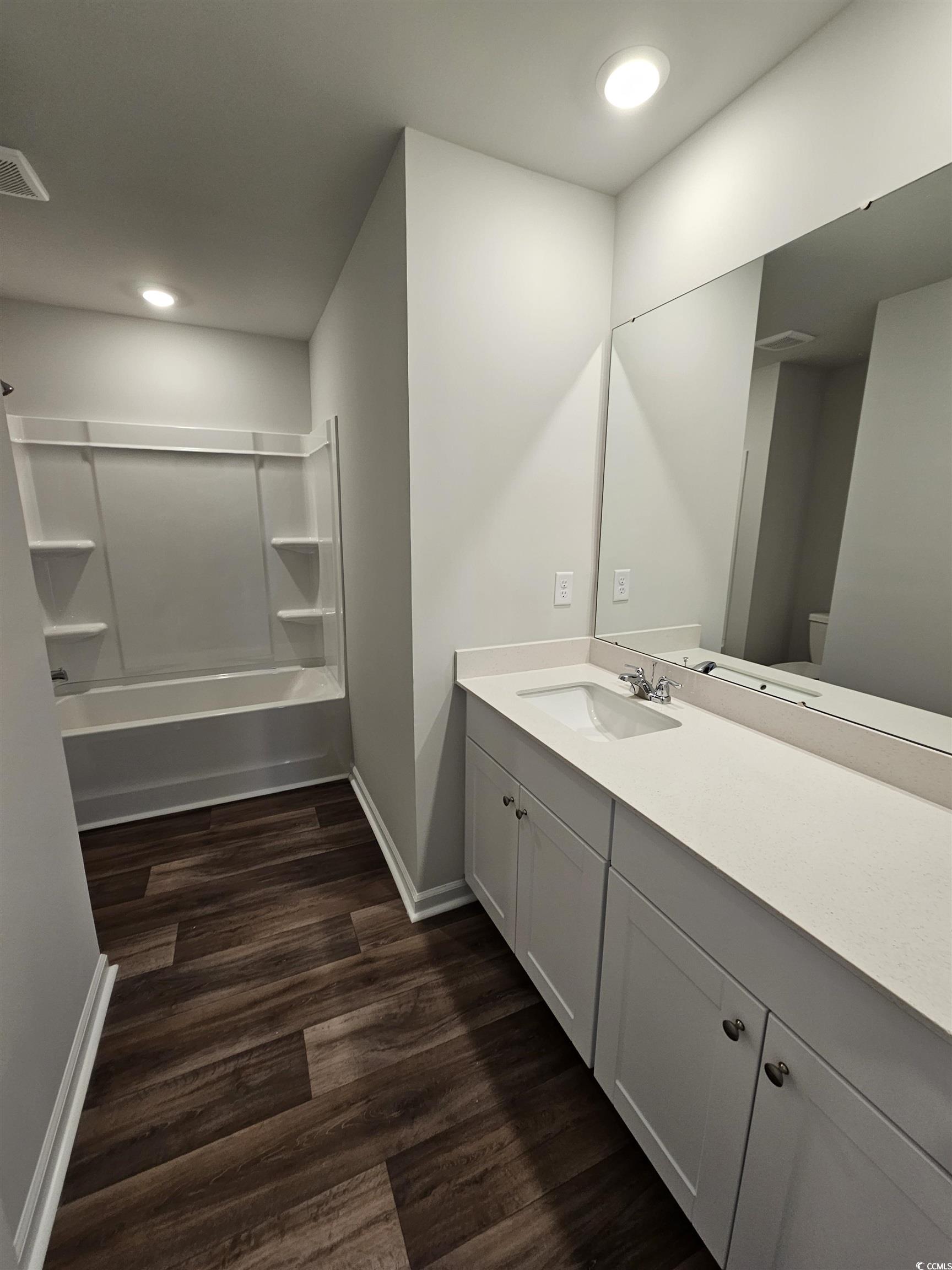 805 Wapama Street Little River, SC 29566 - Photo 15 of 25 Full bathroom with vanity, shower / washtub combination, dark wood-type flooring, and recessed lighting