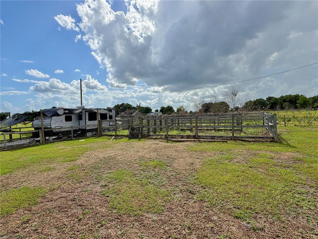 64 West St Road Wauchula, FL 33873 - Photo 6 of 12 a view of a big yard with table and chairs