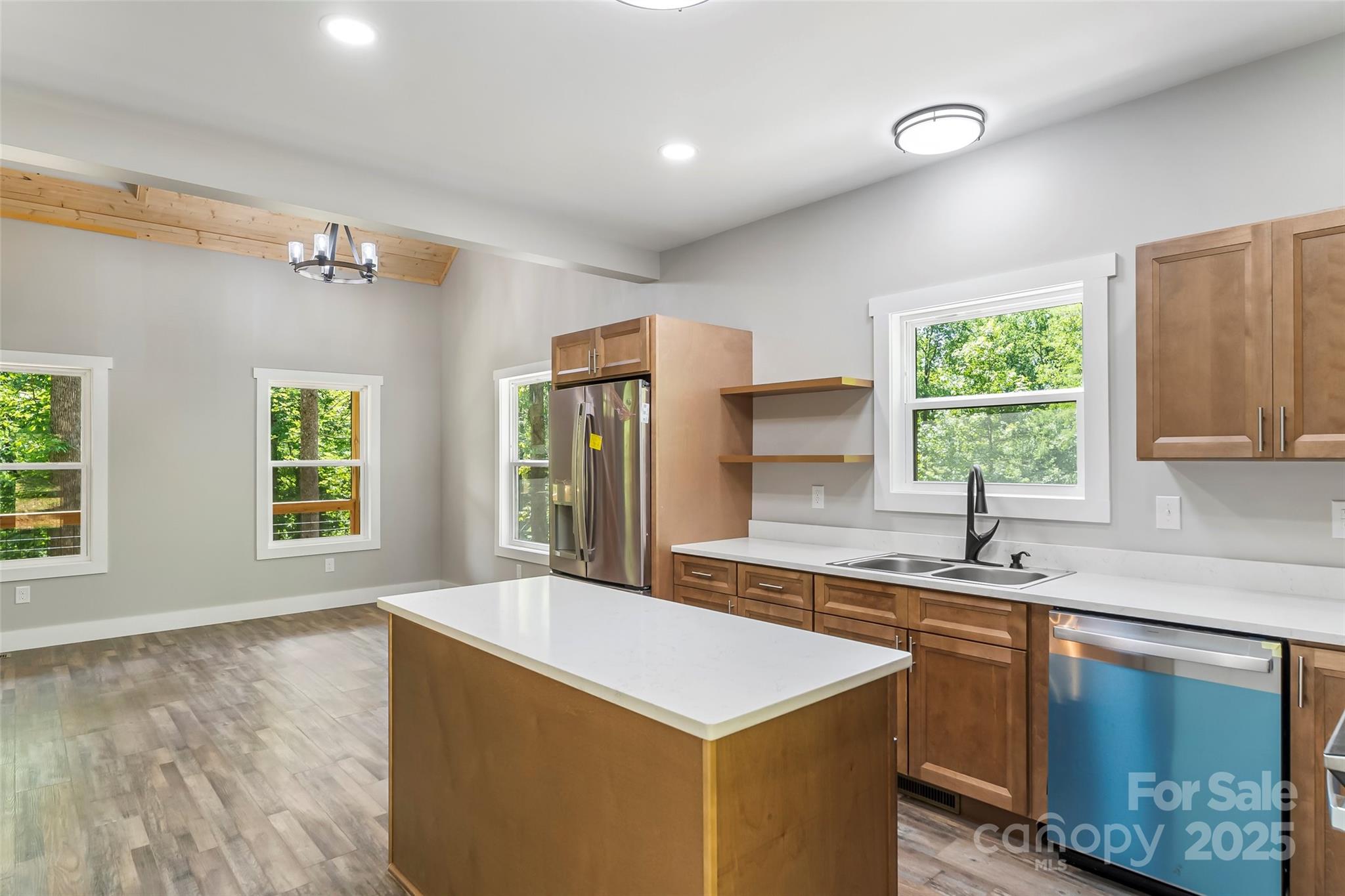 511 Blue Ridge Drive North Marion, NC 28752 - Photo 14 of 41 a kitchen with a sink a window and a refrigerator