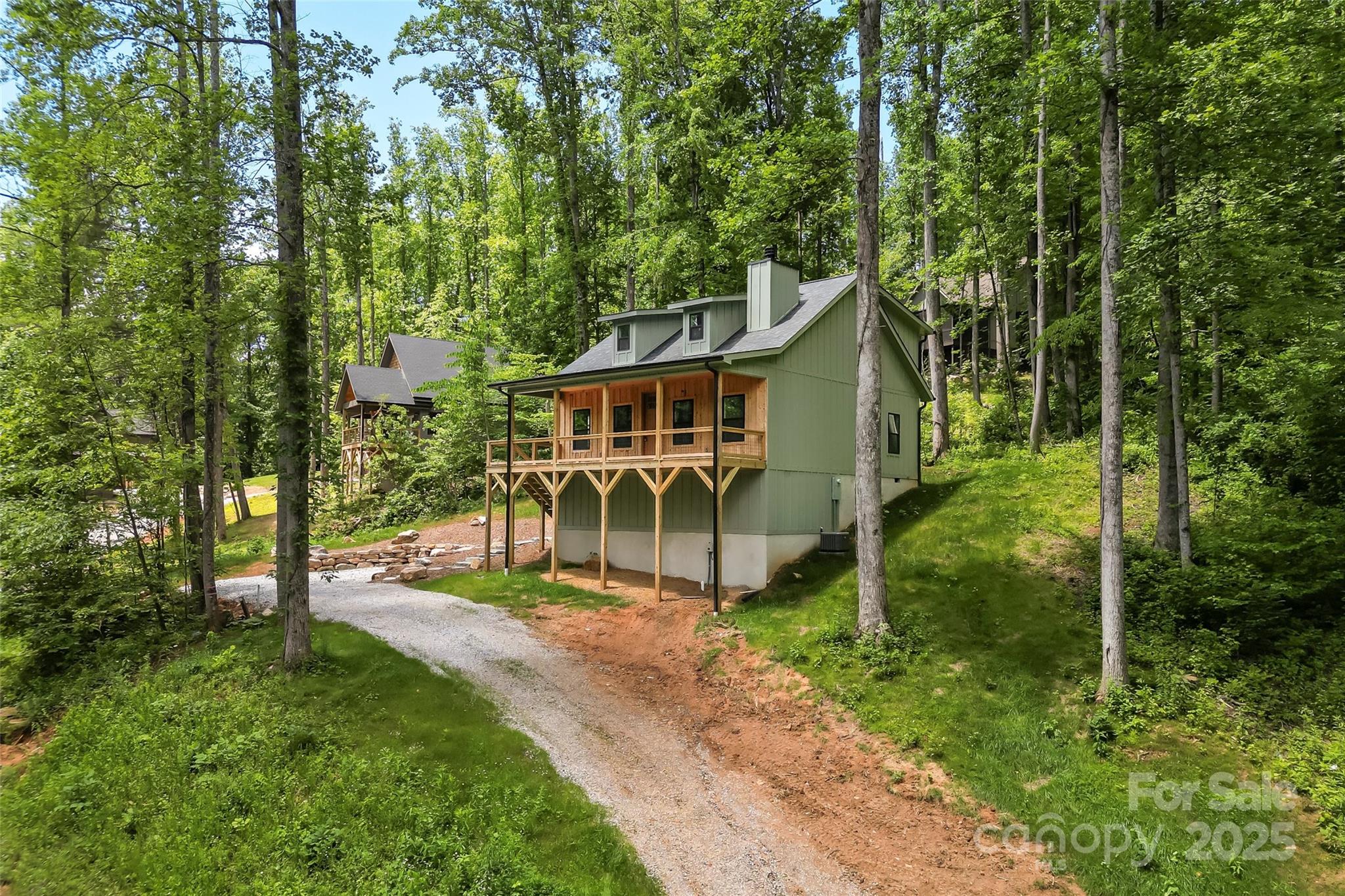 511 Blue Ridge Drive North Marion, NC 28752 - Photo 2 of 41 front view of house with a yard and potted plants